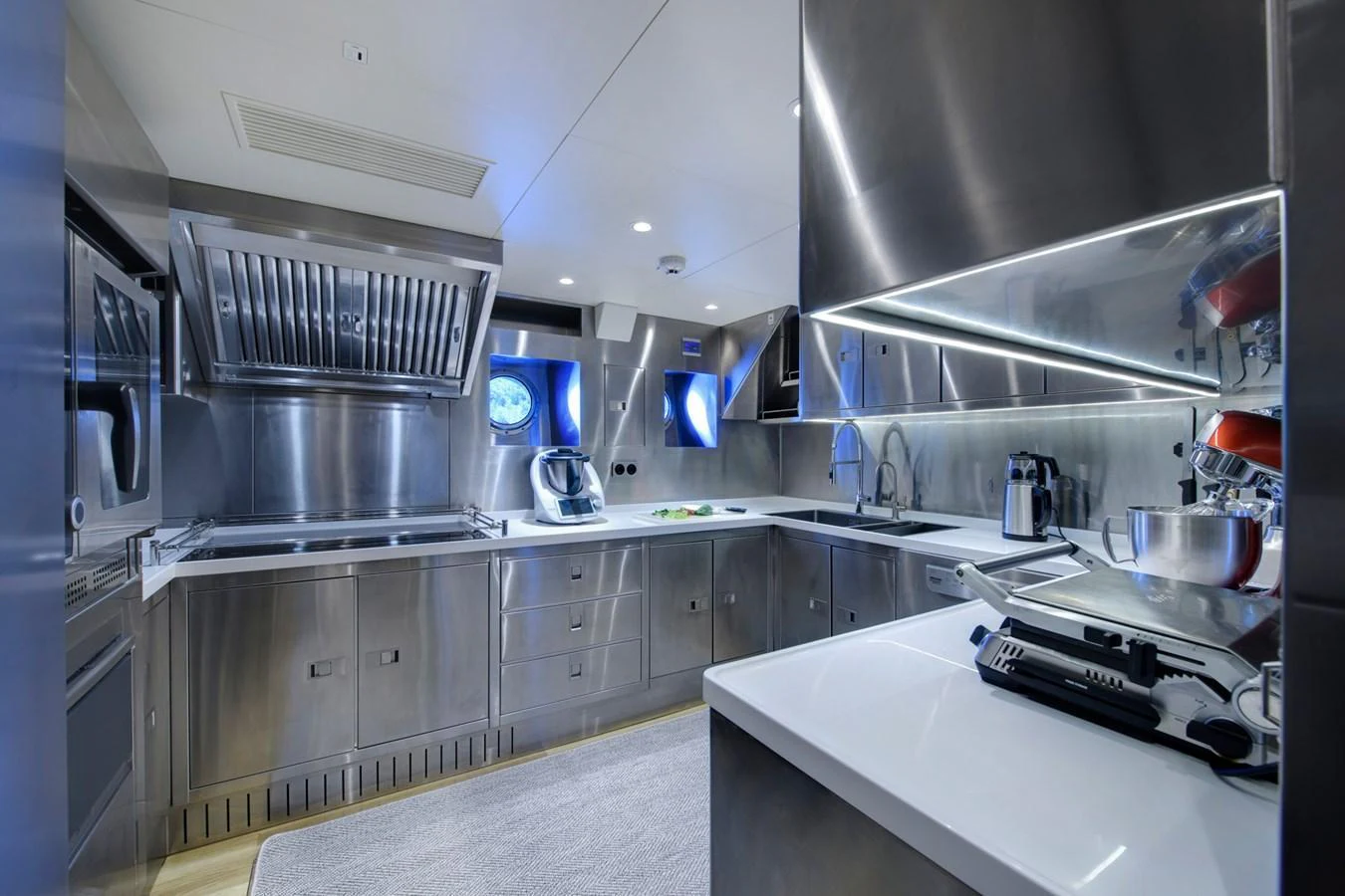 The yacht's galley features sleek stainless steel appliances and modern design elements, creating a professional and efficient cooking environment. aboard SALLYNA Yacht for Sale
