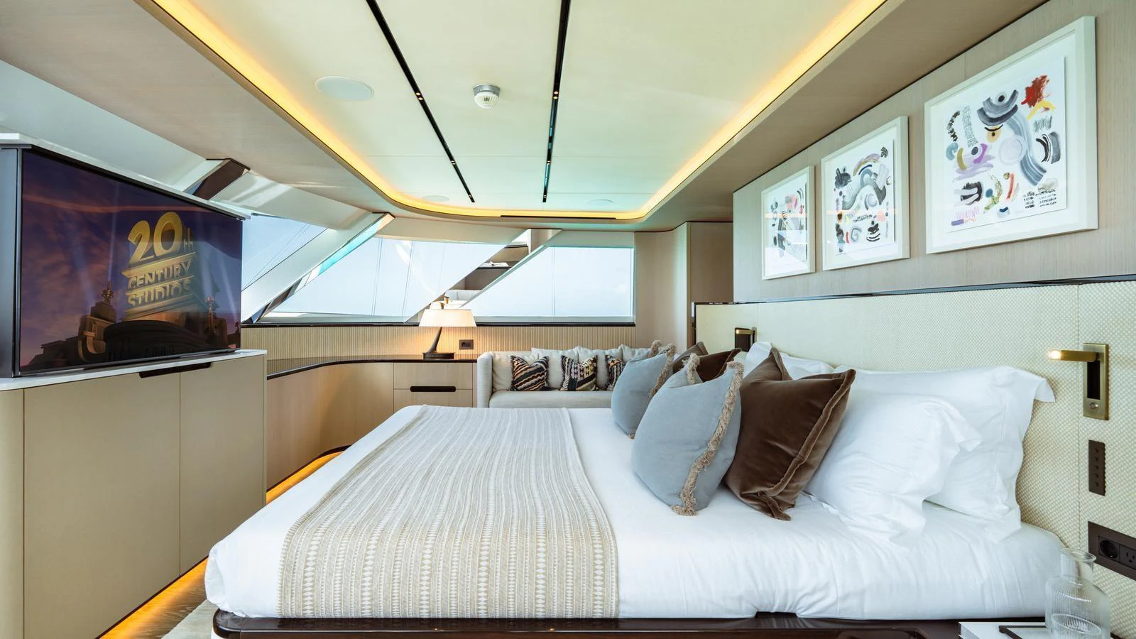 The master stateroom features a luxurious bed, modern decor, and ample natural light. aboard MIDNIGHT SAGA Yacht for Sale