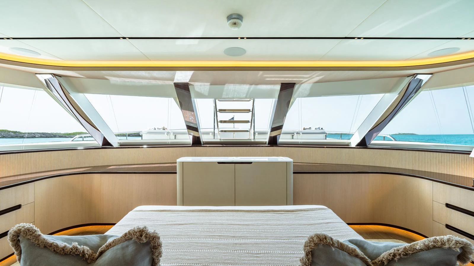 The master stateroom offers panoramic views with luxurious bedding and elegant design. aboard MIDNIGHT SAGA Yacht for Sale