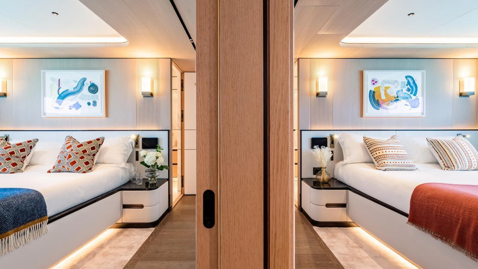 The guest stateroom features twin beds with stylish decor and modern lighting. aboard MIDNIGHT SAGA Yacht for Sale