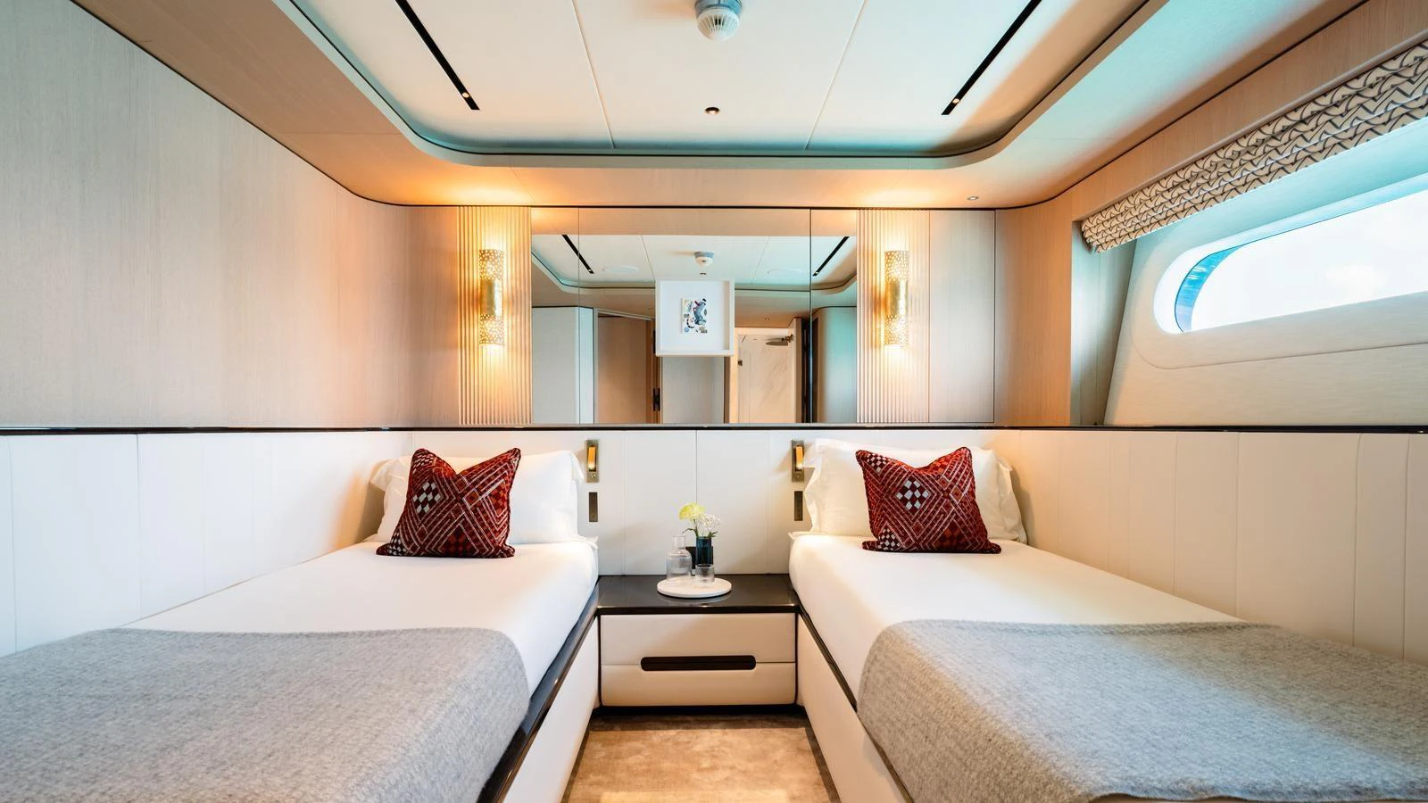 The twin stateroom offers a serene and luxurious retreat with modern decor and ample natural light. aboard MIDNIGHT SAGA Yacht for Sale