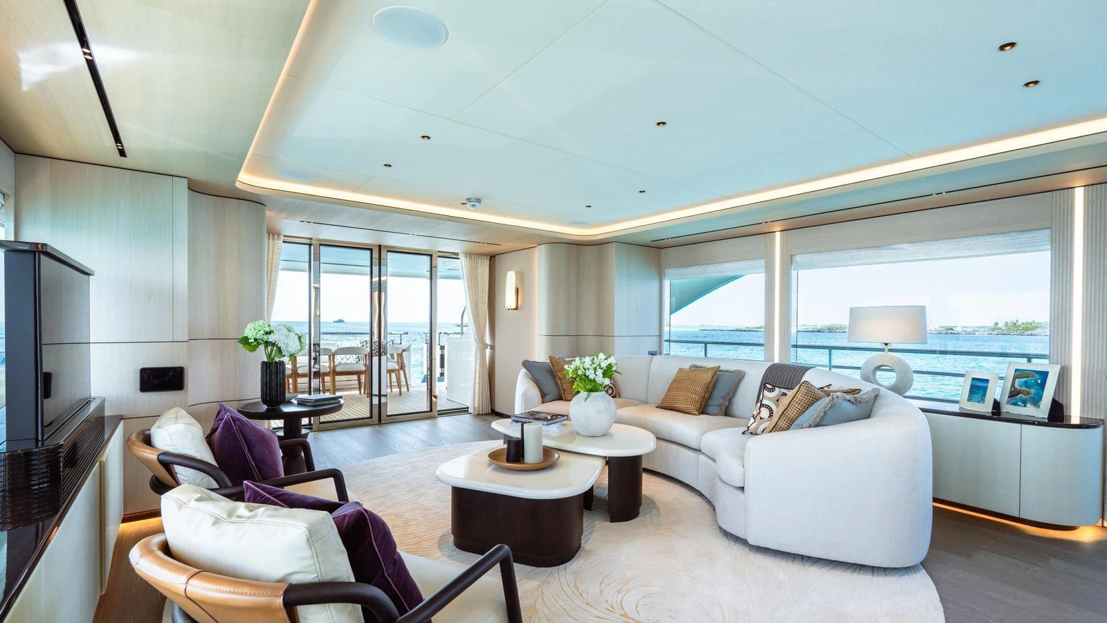 The salon offers a spacious and elegant living area with panoramic views and luxurious furnishings. aboard MIDNIGHT SAGA Yacht for Sale