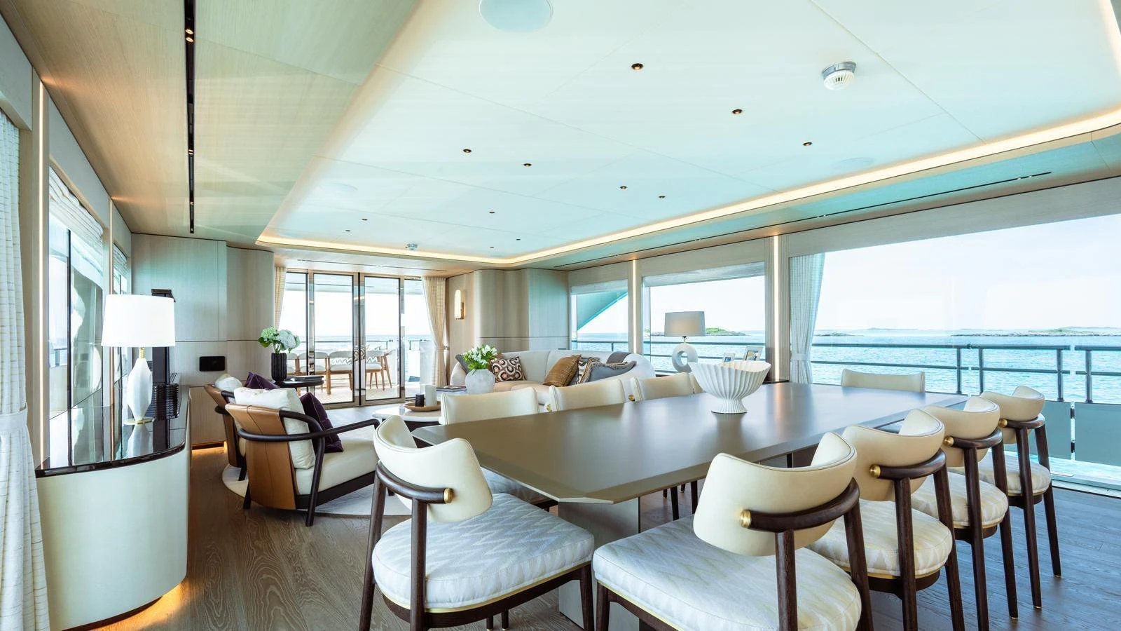 The spacious salon offers elegant dining and lounging areas with panoramic views. aboard MIDNIGHT SAGA Yacht for Sale