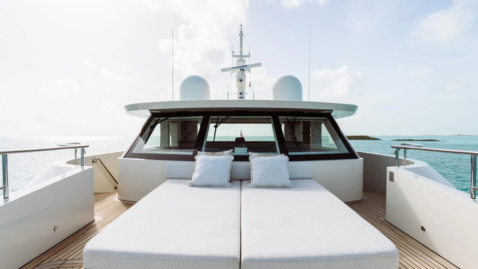 The foredeck features luxurious sunbeds with a stunning view of the ocean. aboard MIDNIGHT SAGA Yacht for Sale