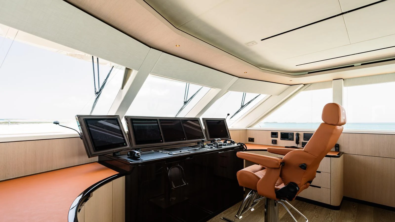 The helm station features state-of-the-art navigation equipment and a luxurious captain's chair. aboard MIDNIGHT SAGA Yacht for Sale