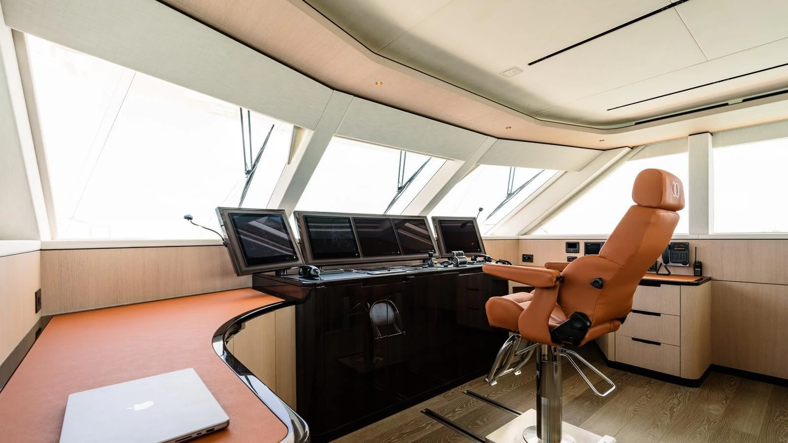 The helm station features state-of-the-art navigation equipment and a luxurious captain's chair. aboard MIDNIGHT SAGA Yacht for Sale