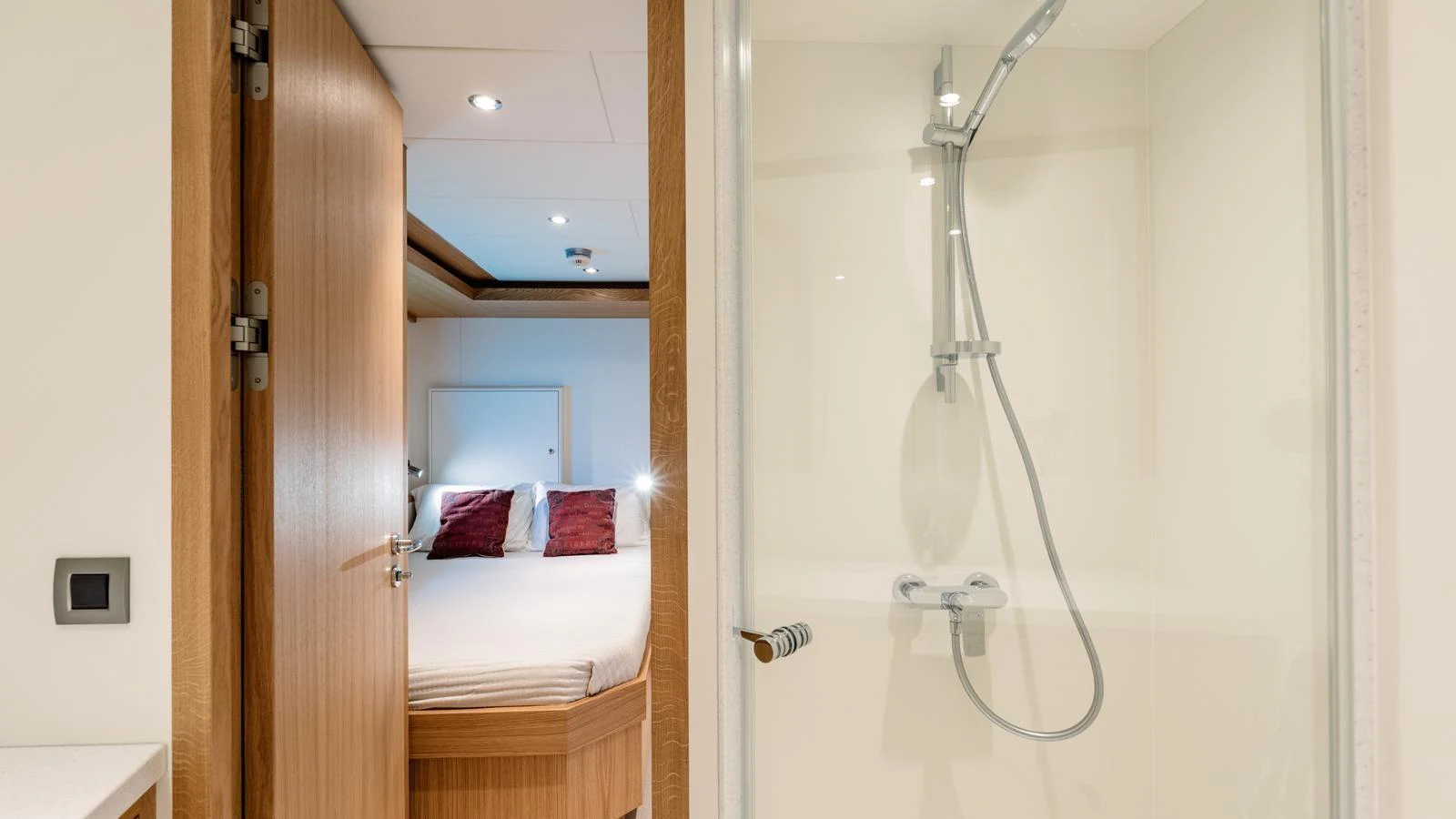 A cozy stateroom with an ensuite bathroom featuring a modern shower. aboard MIDNIGHT SAGA Yacht for Sale