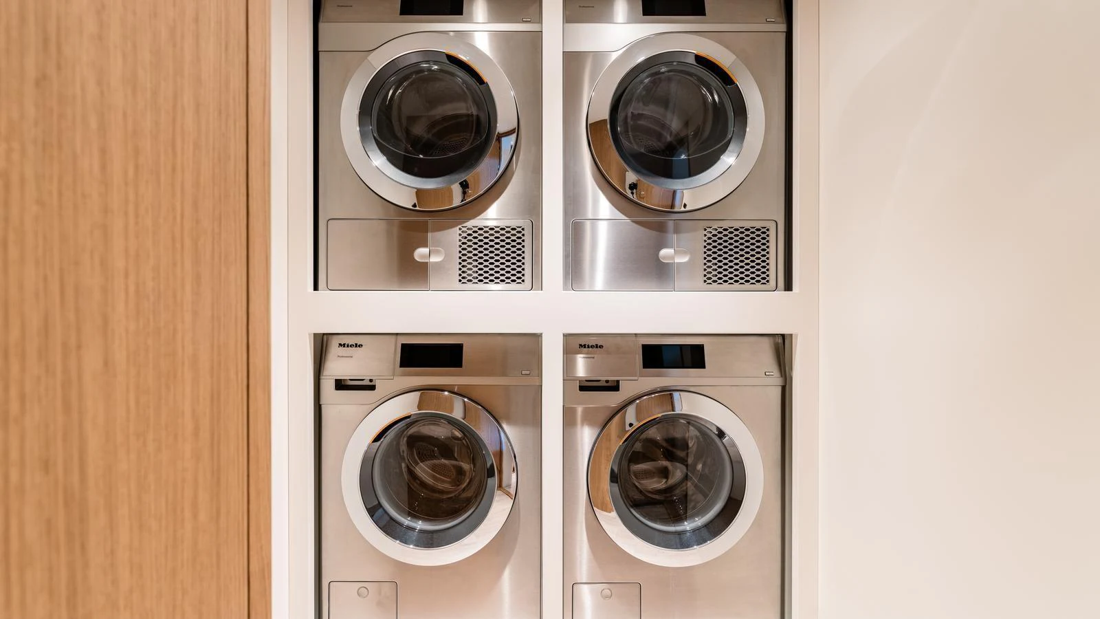 The yacht features a well-equipped laundry room with modern appliances. aboard MIDNIGHT SAGA Yacht for Sale