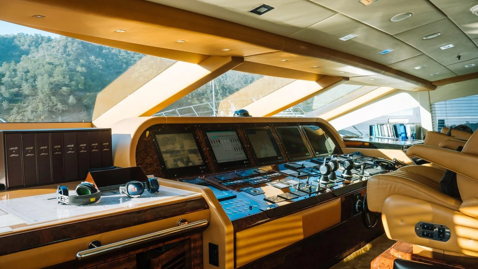 The helm station features advanced navigation equipment and luxurious seating, offering a commanding view for the captain. aboard SEA PEARL Yacht for Sale