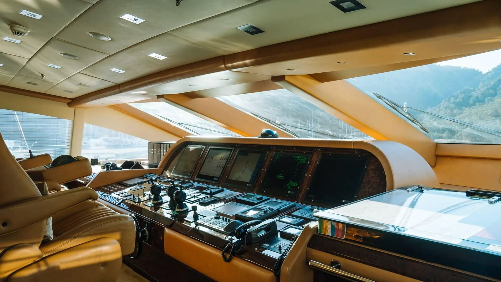 The helm of the yacht features advanced navigation equipment and luxurious seating, offering a commanding view of the surroundings. aboard SEA PEARL Yacht for Sale