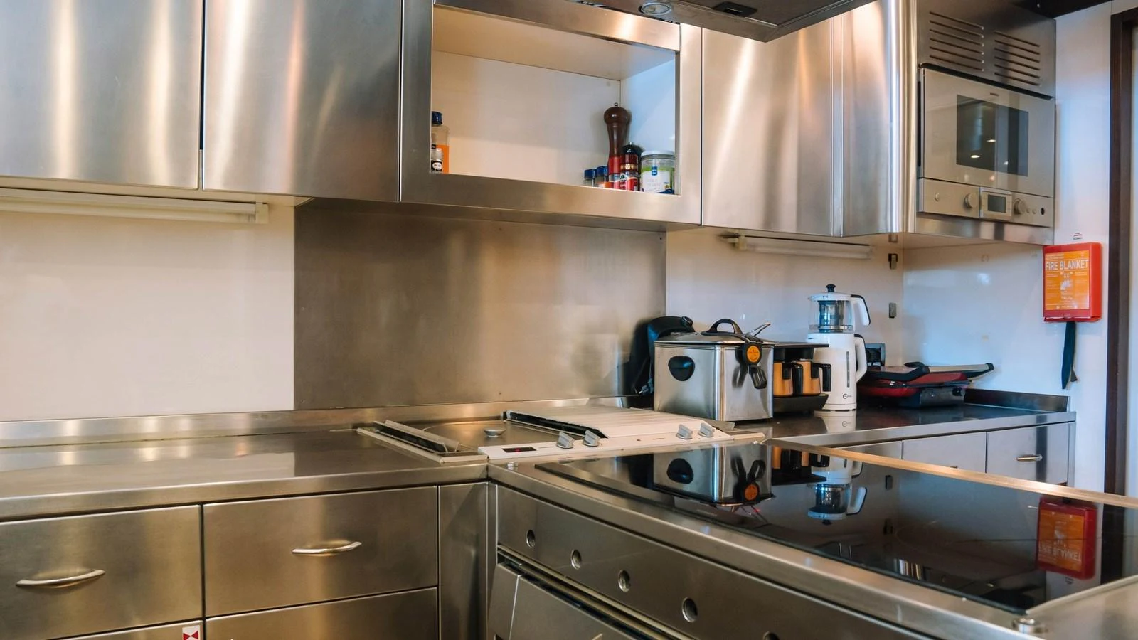 The yacht's galley features sleek stainless steel appliances and ample counter space. aboard SEA PEARL Yacht for Sale