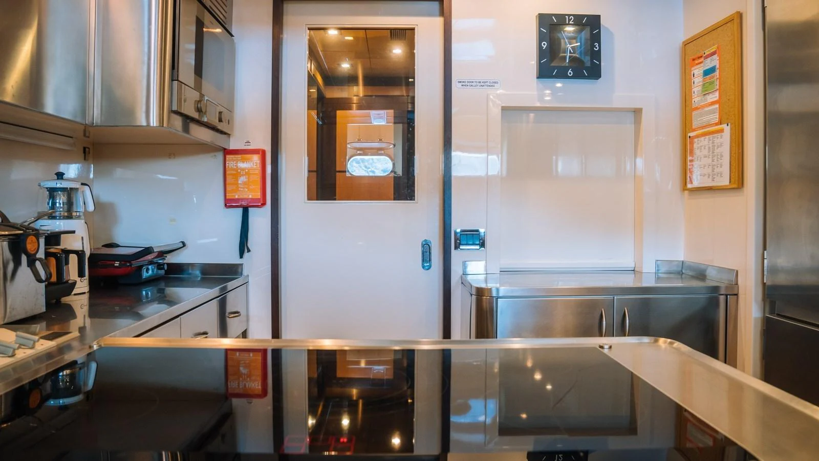 The galley is equipped with modern appliances and ample counter space for meal preparation. aboard SEA PEARL Yacht for Sale