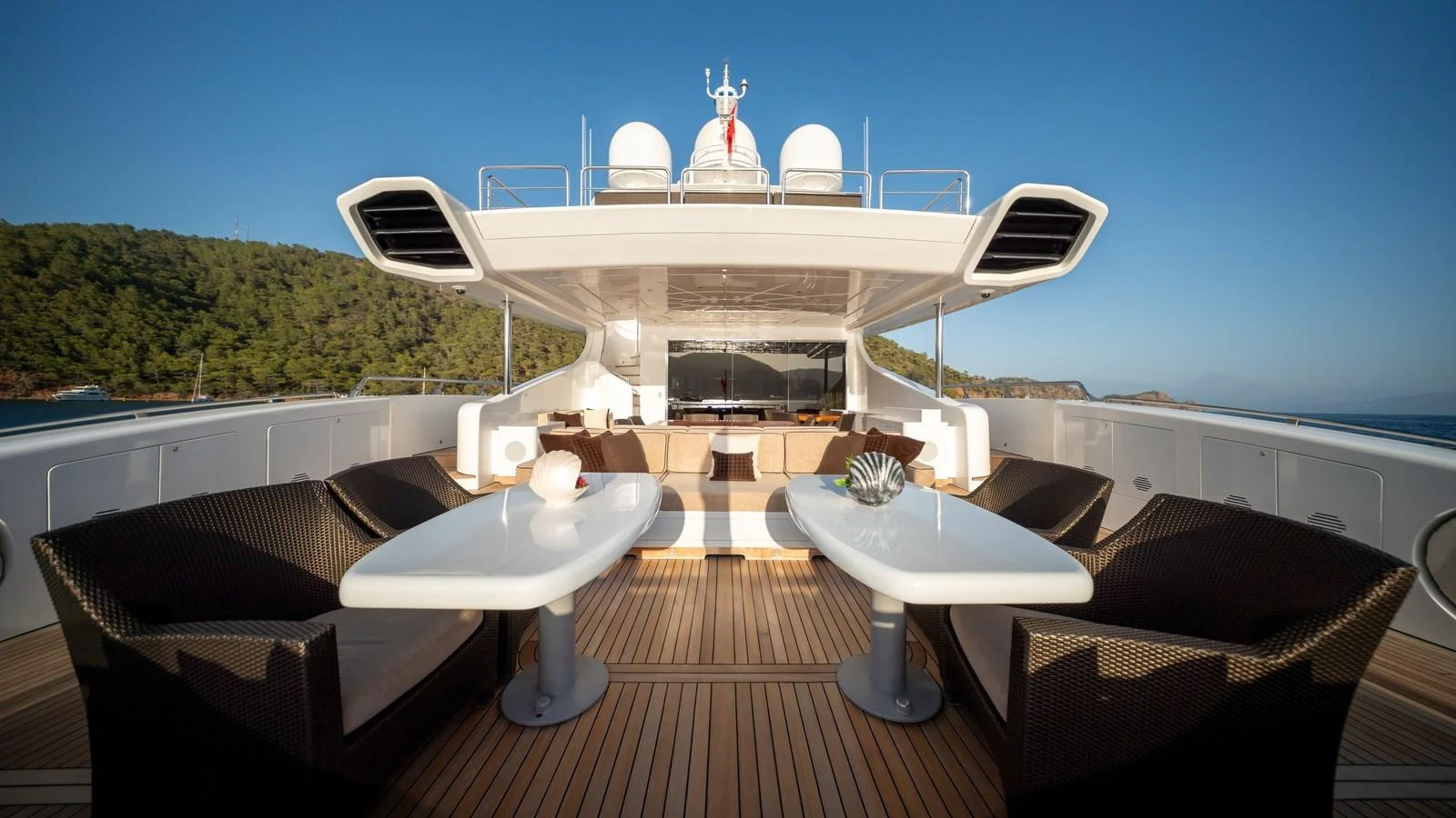 The yacht's aft deck offers a luxurious outdoor seating area with stunning views. aboard SEA PEARL Yacht for Sale