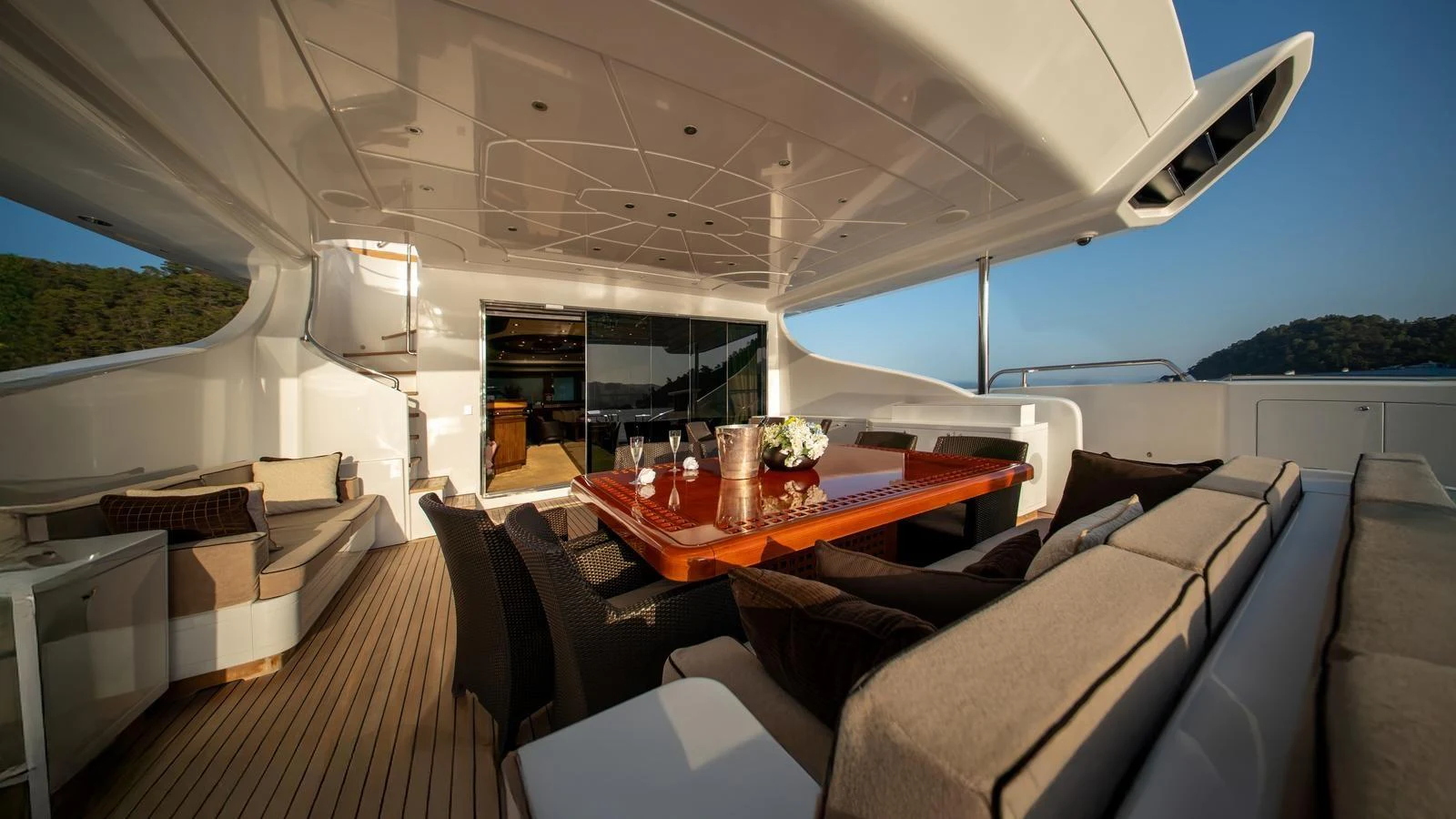 The aft deck features a spacious dining area with comfortable seating and elegant decor. aboard SEA PEARL Yacht for Sale