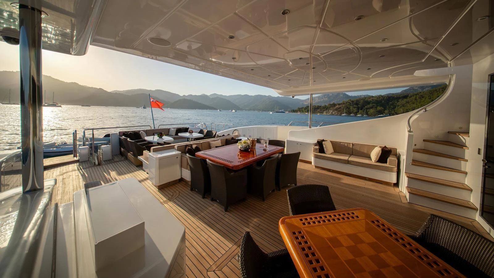 The aft deck offers a spacious and luxurious outdoor seating and dining area with stunning views of the water and surrounding landscape. aboard SEA PEARL Yacht for Sale