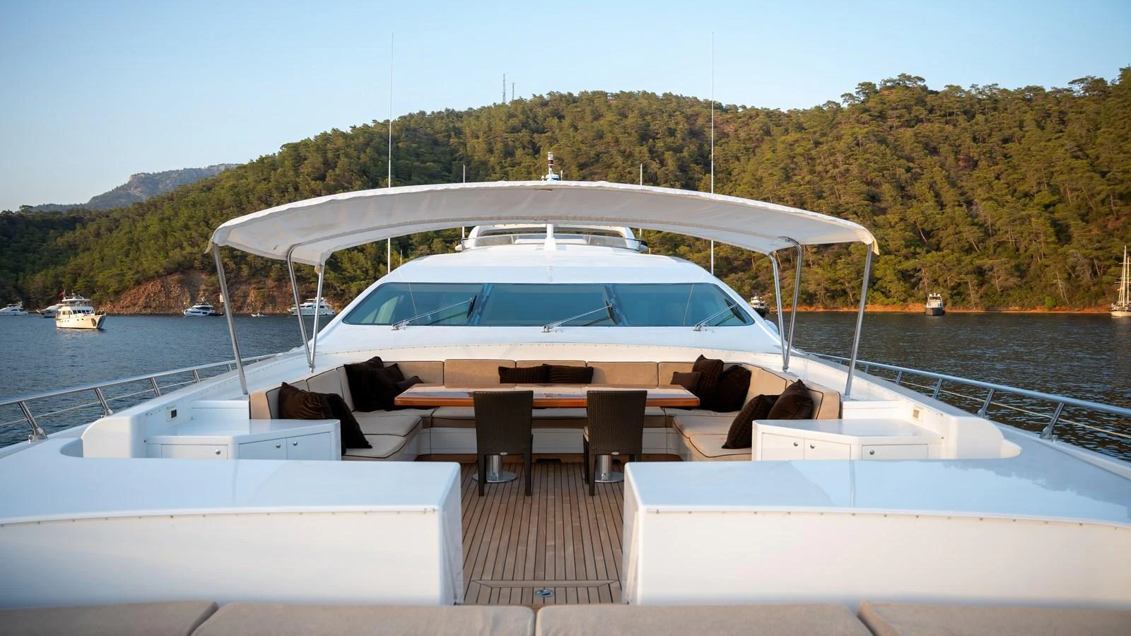 The yacht's foredeck features a spacious seating area with a canopy, perfect for relaxation and socializing. aboard SEA PEARL Yacht for Sale