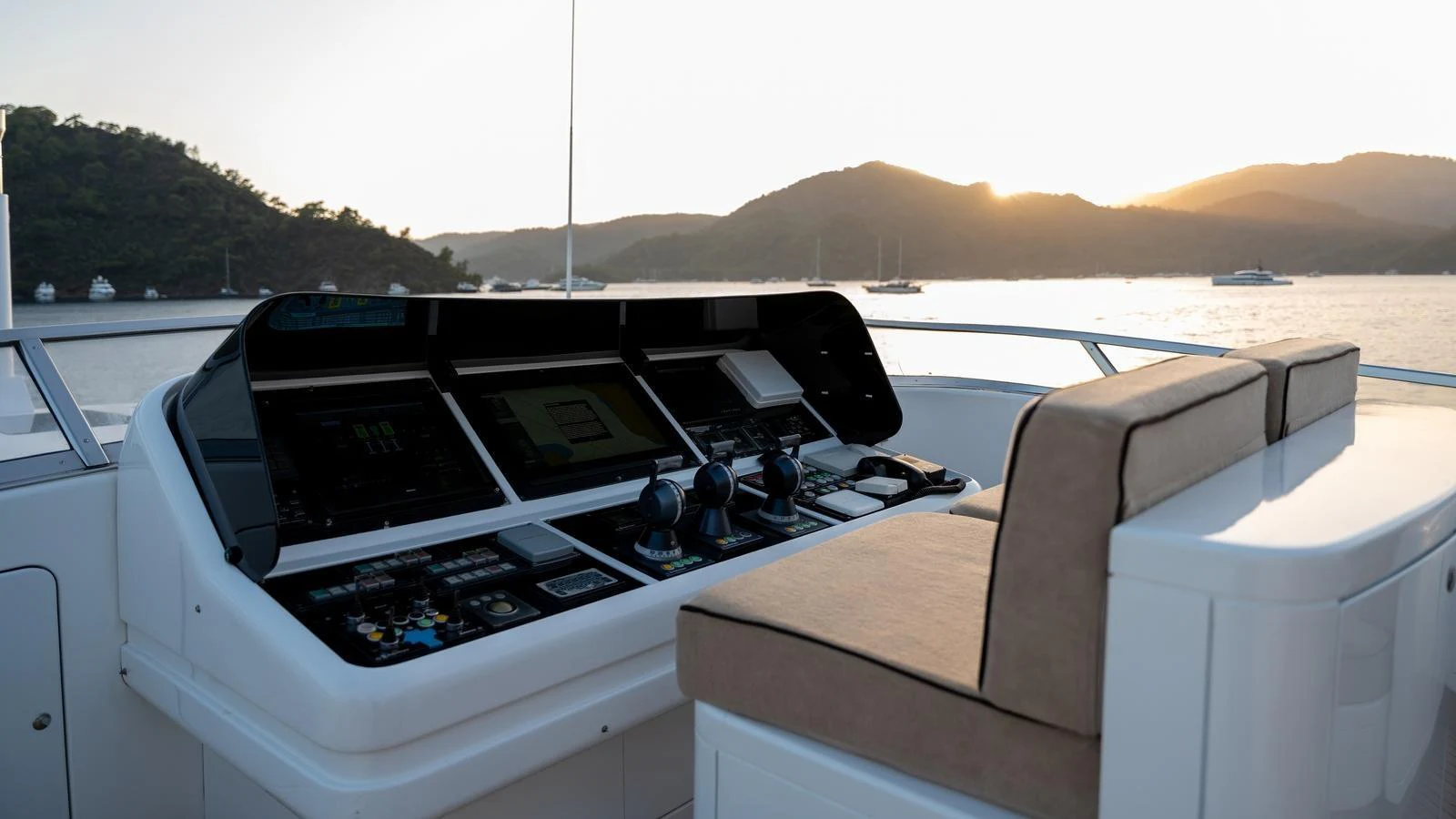 The helm station offers a commanding view of the serene waters and surrounding landscape. aboard SEA PEARL Yacht for Sale