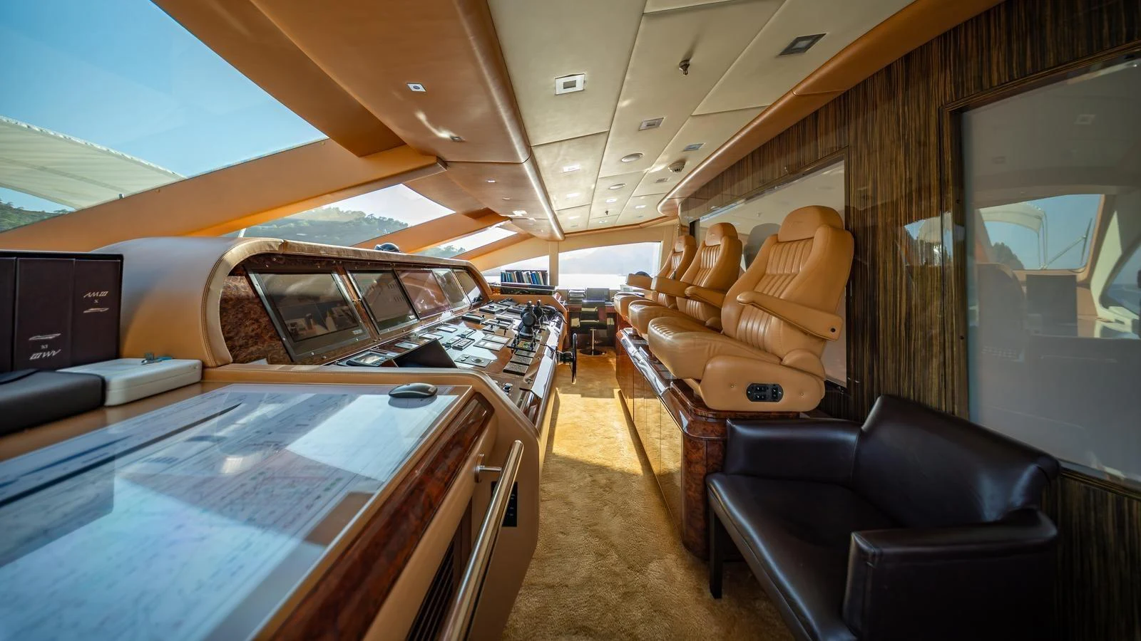The helm station features luxurious seating and state-of-the-art navigation equipment. aboard SEA PEARL Yacht for Sale