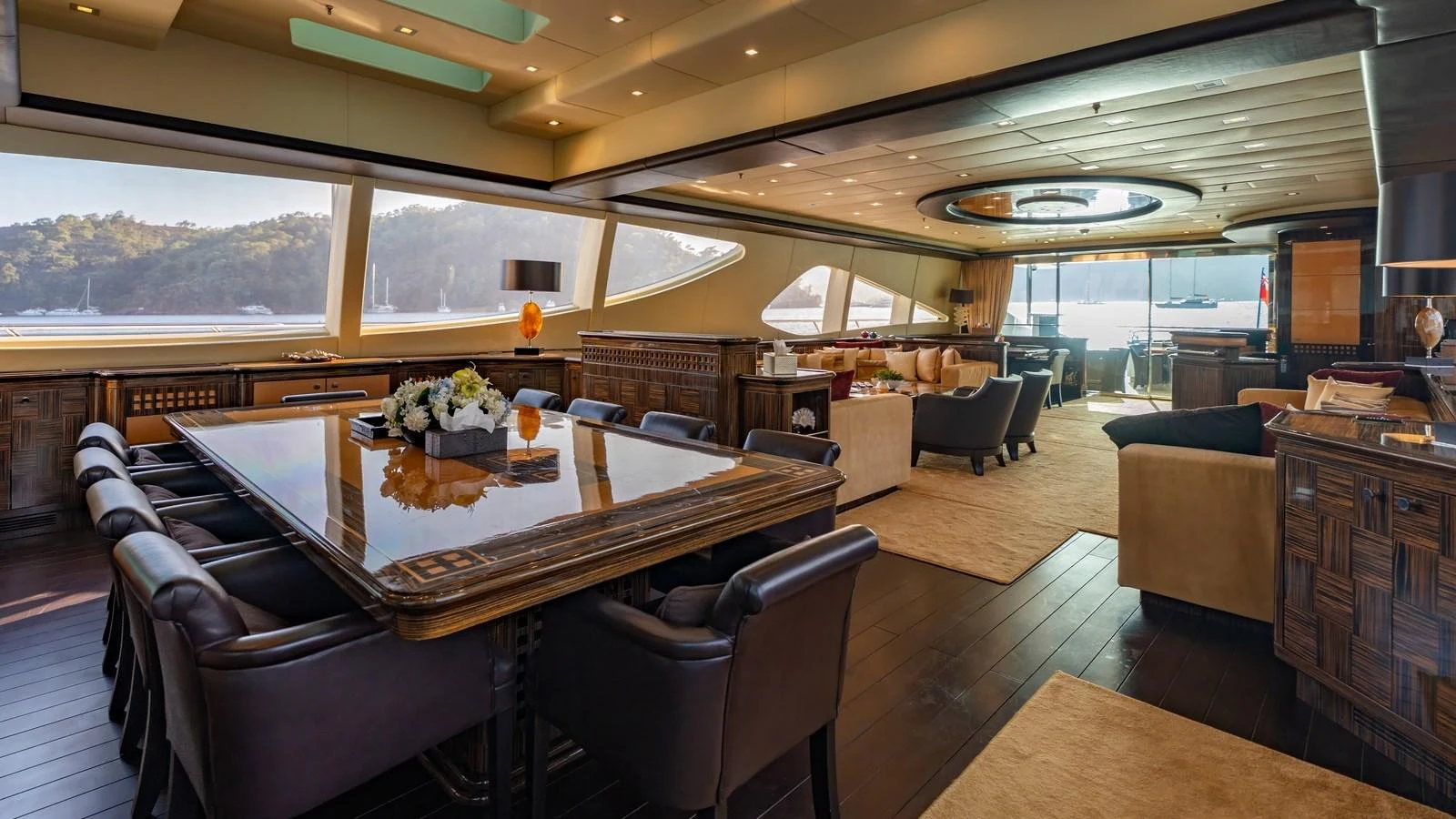 The spacious salon features elegant furnishings and expansive windows offering stunning views. aboard SEA PEARL Yacht for Sale