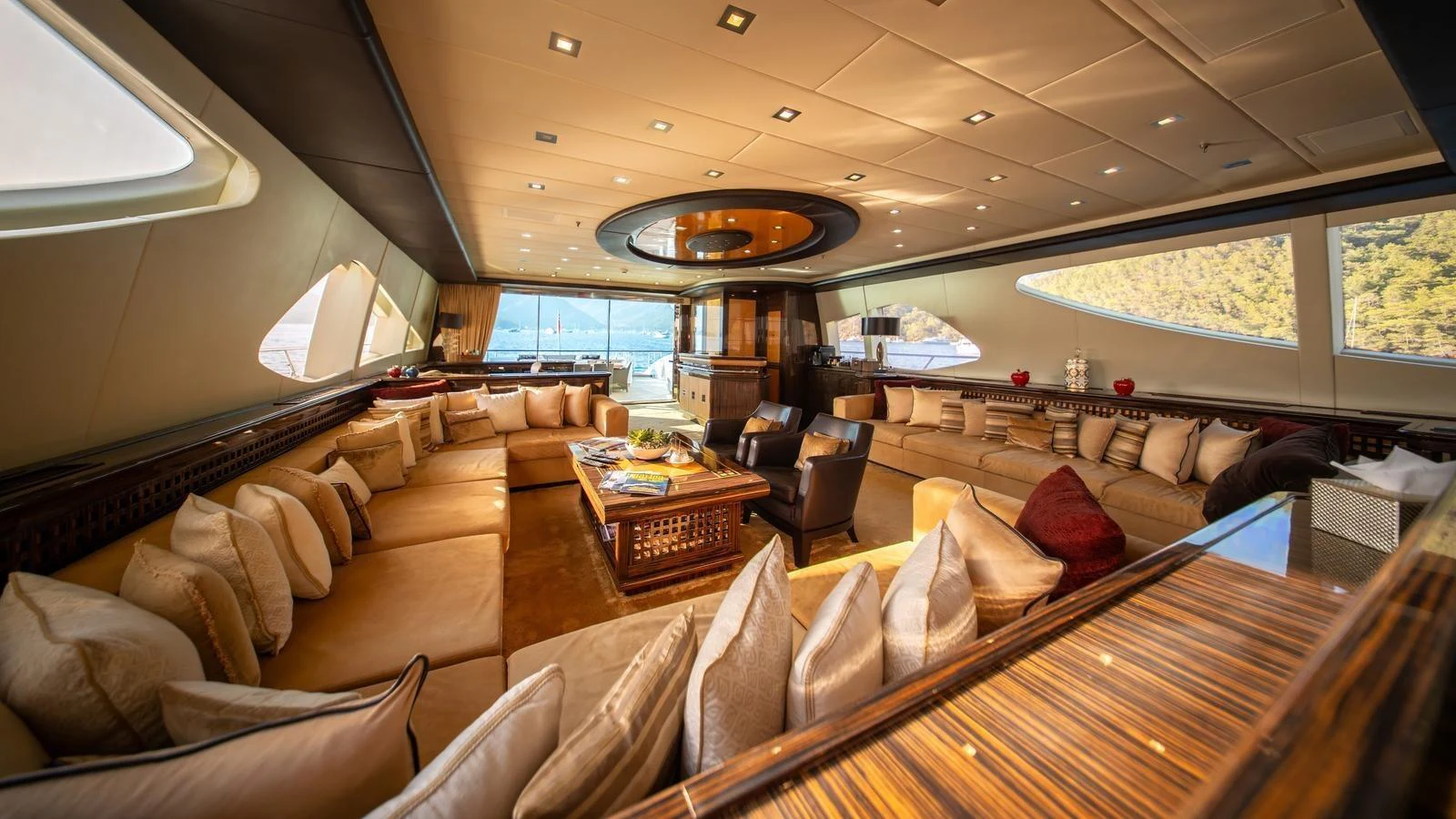 The luxurious salon features plush seating and panoramic windows offering stunning views. aboard SEA PEARL Yacht for Sale
