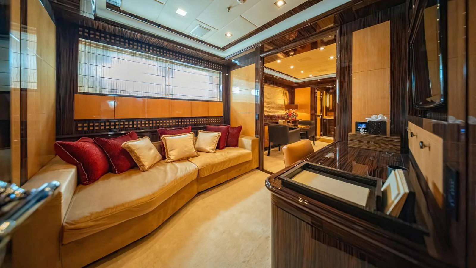 The yacht's salon features luxurious seating and elegant wood paneling. aboard SEA PEARL Yacht for Sale