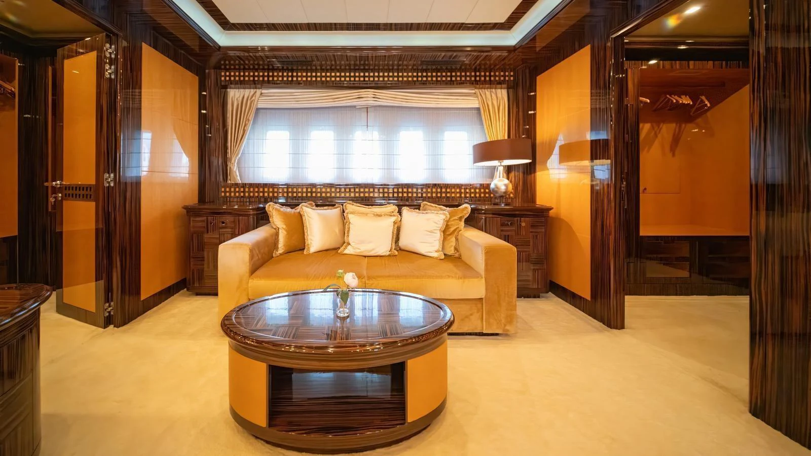 The yacht's interior features a luxurious seating area with a plush sofa and elegant decor. aboard SEA PEARL Yacht for Sale