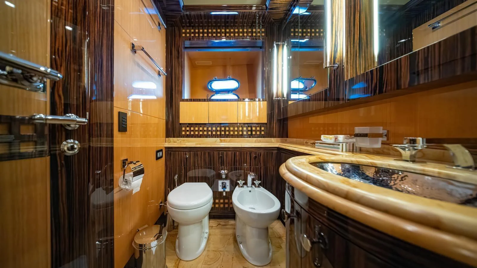The yacht's bathroom features luxurious wood paneling and modern fixtures. aboard SEA PEARL Yacht for Sale