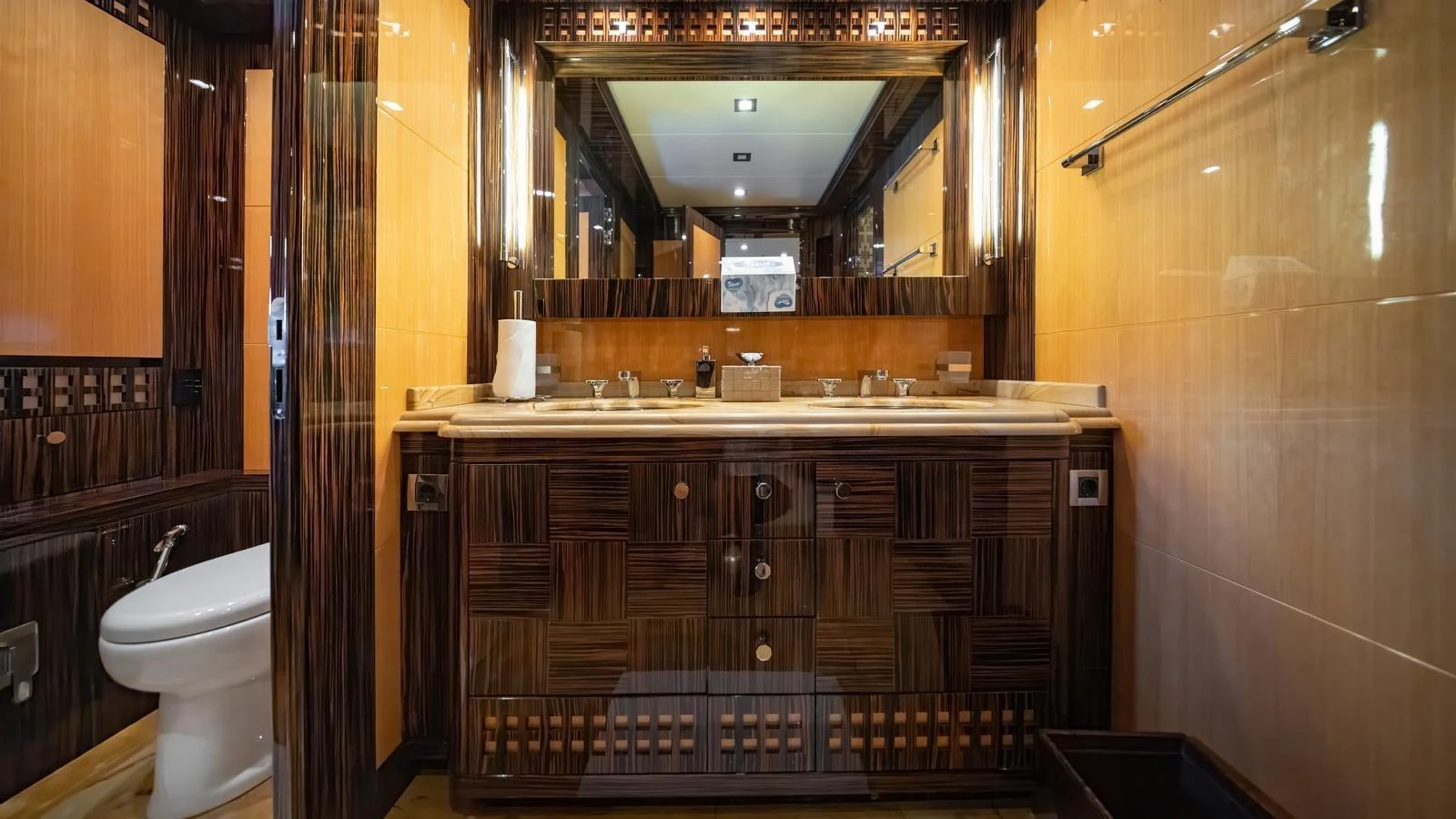 The yacht's bathroom features luxurious wood accents and modern fixtures. aboard SEA PEARL Yacht for Sale