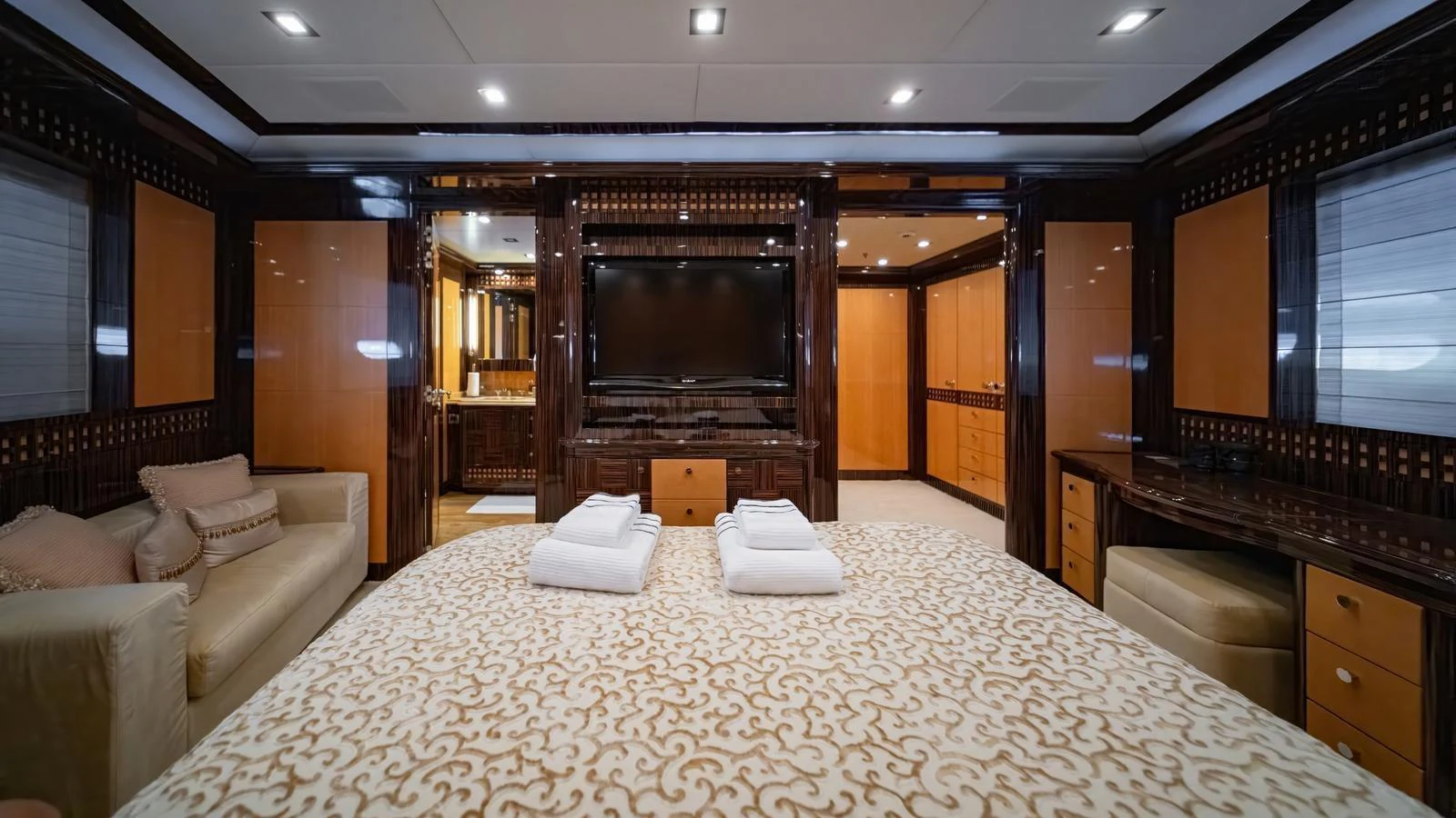 The master stateroom features luxurious bedding, ample storage, and elegant decor. aboard SEA PEARL Yacht for Sale