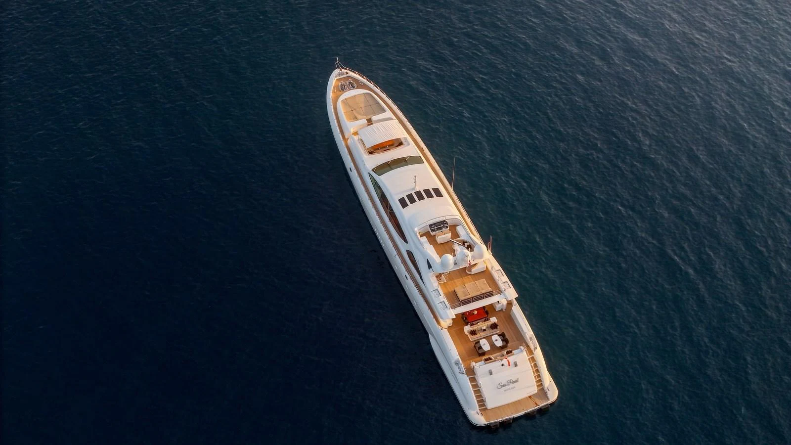 Aerial view of a luxurious yacht cruising on calm waters. aboard SEA PEARL Yacht for Sale
