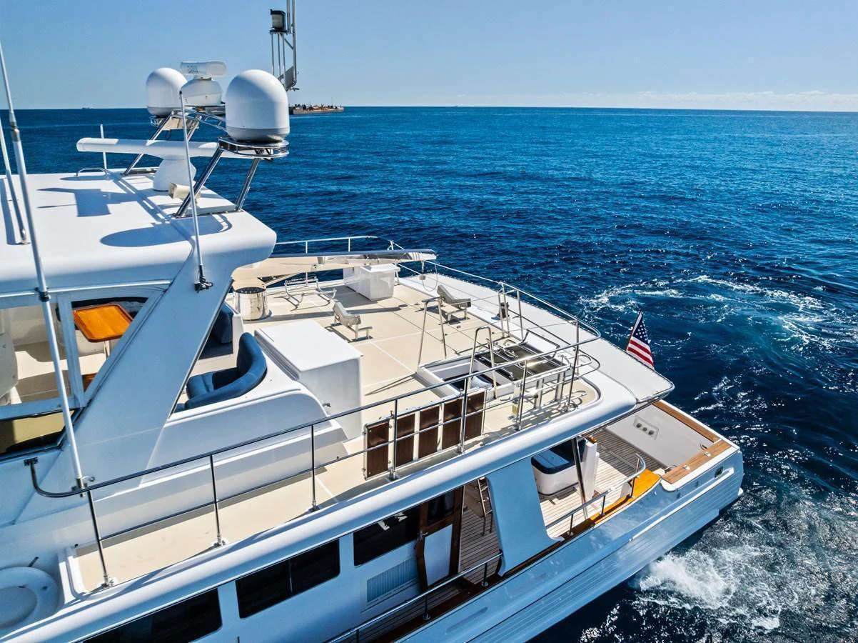 The yacht's aft deck offers a spacious and inviting area for relaxation and entertainment on the open water. aboard EL LEGADO Yacht for Sale
