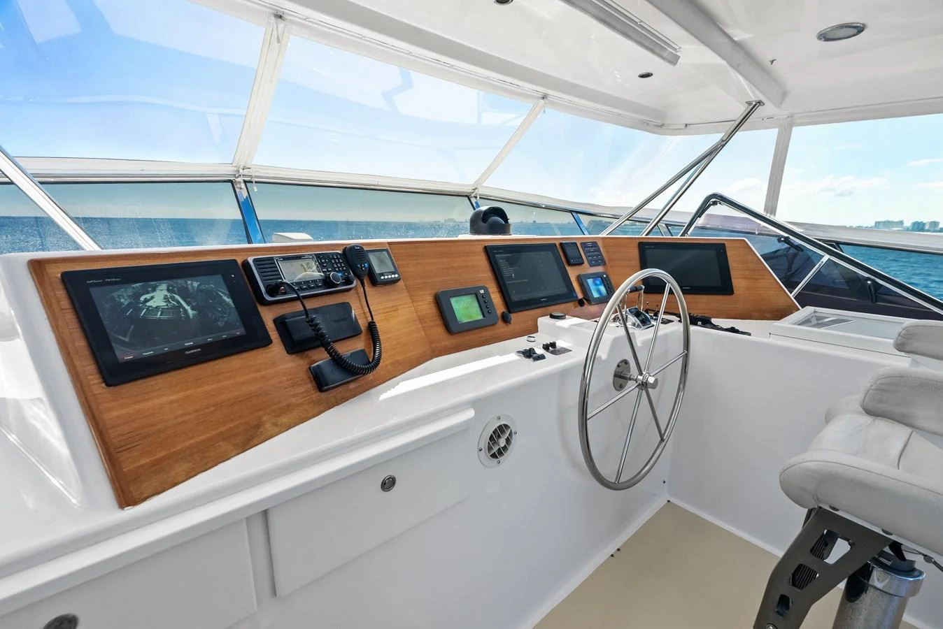 The helm station features advanced navigation equipment and a sleek, modern design. aboard EL LEGADO Yacht for Sale