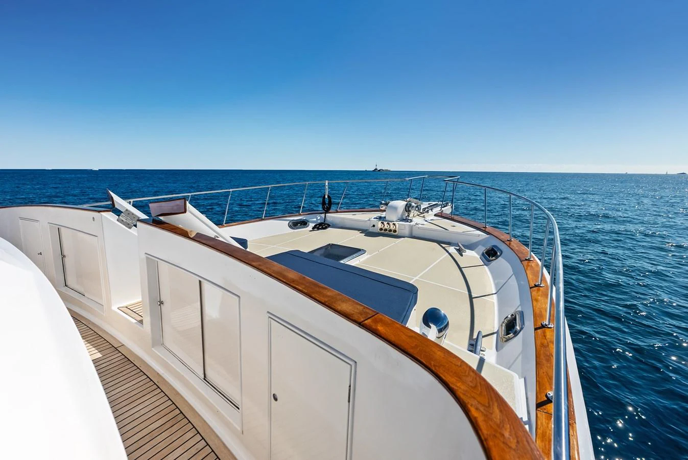 The foredeck of the yacht offers a spacious and inviting area for relaxation with stunning ocean views. aboard EL LEGADO Yacht for Sale