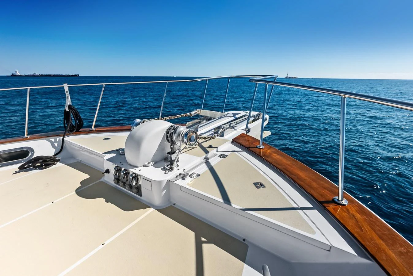 The foredeck features a well-equipped anchor system with a clear view of the open sea. aboard EL LEGADO Yacht for Sale