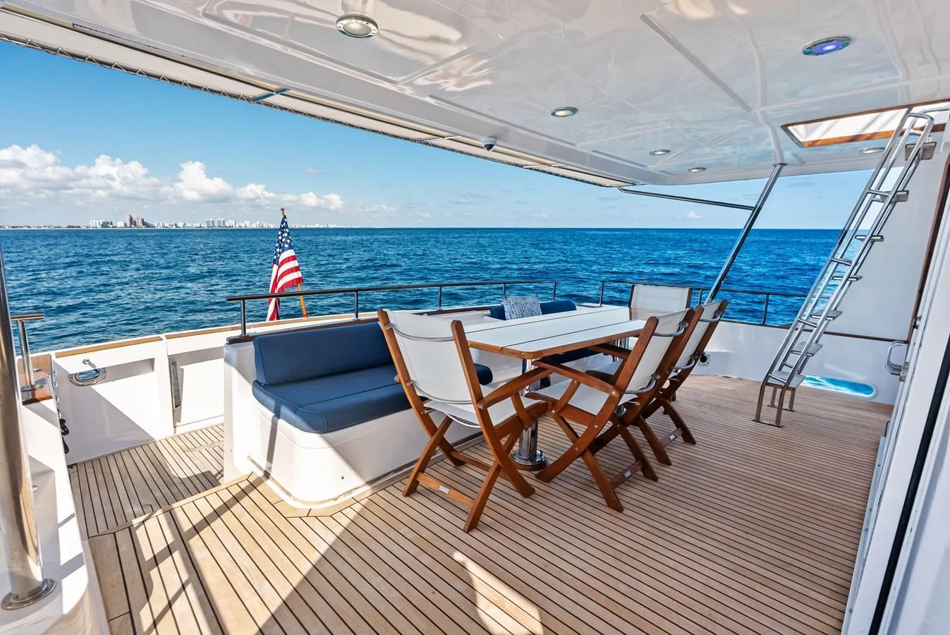 The aft deck offers a spacious and inviting area for alfresco dining with stunning ocean views. aboard EL LEGADO Yacht for Sale