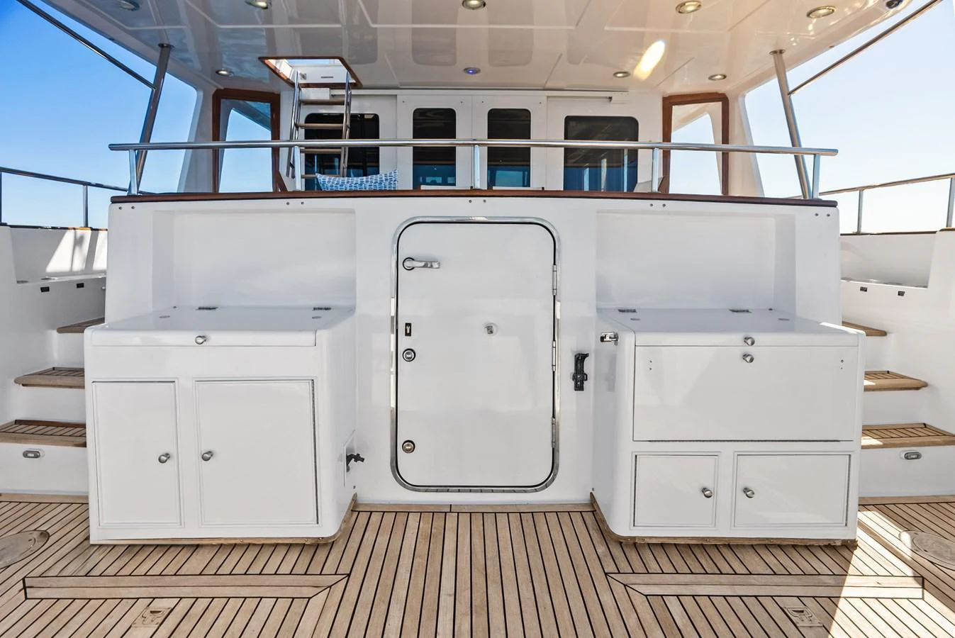 The aft deck features ample storage and a clean, functional design. aboard EL LEGADO Yacht for Sale