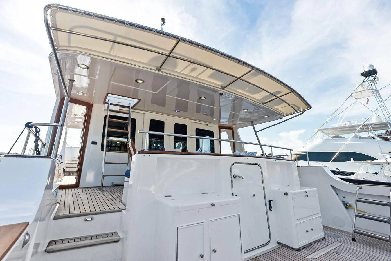 The spacious aft deck offers a welcoming area for relaxation and entertainment. aboard EL LEGADO Yacht for Sale