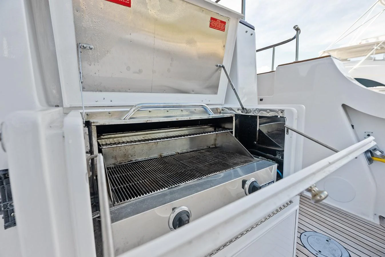 The yacht features a built-in stainless steel grill, perfect for outdoor cooking. aboard EL LEGADO Yacht for Sale