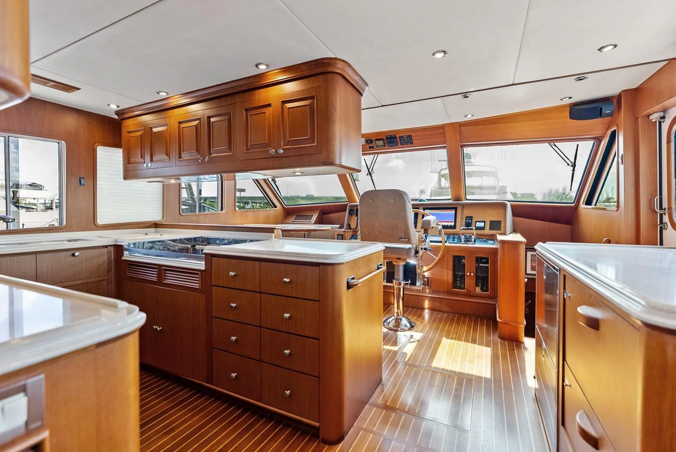 The helm area features a spacious and well-appointed control station with ample natural light. aboard EL LEGADO Yacht for Sale