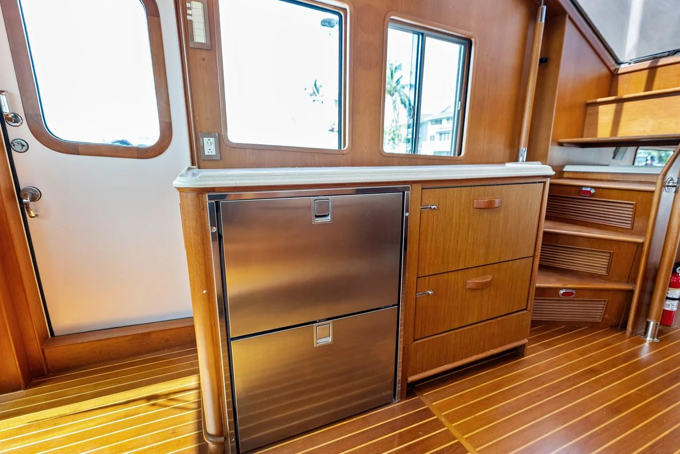 The yacht's interior features a well-appointed galley area with ample storage and modern appliances. aboard EL LEGADO Yacht for Sale