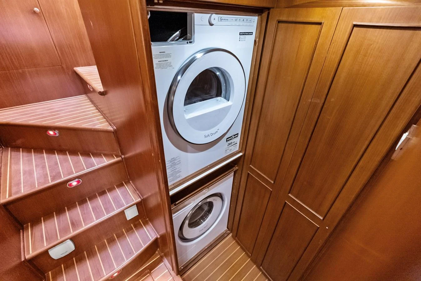 The yacht features a dedicated laundry area with modern appliances. aboard EL LEGADO Yacht for Sale