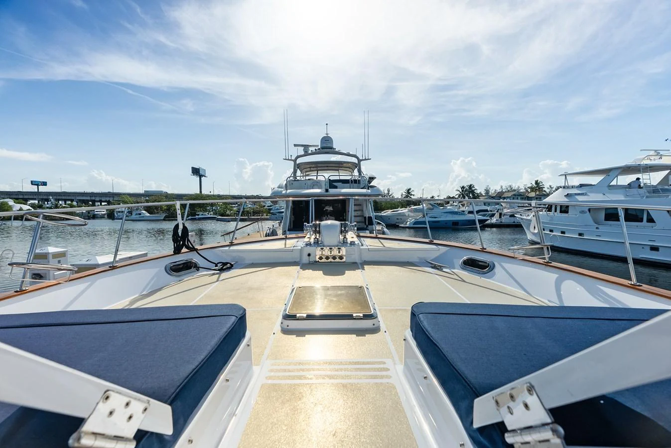 The foredeck offers a spacious and inviting area for relaxation with comfortable seating and a clear view of the marina. aboard EL LEGADO Yacht for Sale