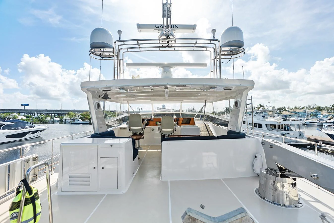 The yacht's flybridge offers a spacious and well-equipped area for navigation and relaxation. aboard EL LEGADO Yacht for Sale