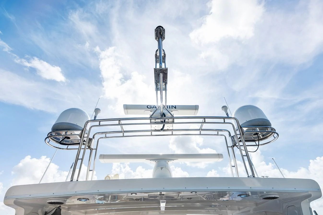 A close-up view of the yacht's radar and communication equipment against a bright sky. aboard EL LEGADO Yacht for Sale