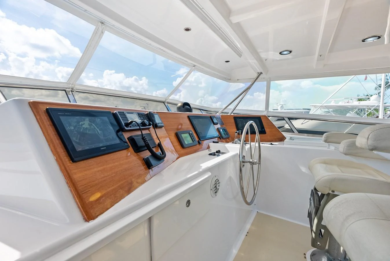 The helm station features modern navigation equipment and comfortable seating, offering a commanding view for the captain. aboard EL LEGADO Yacht for Sale