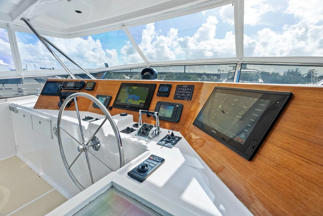 The helm station features state-of-the-art navigation equipment and a sleek, modern design. aboard EL LEGADO Yacht for Sale