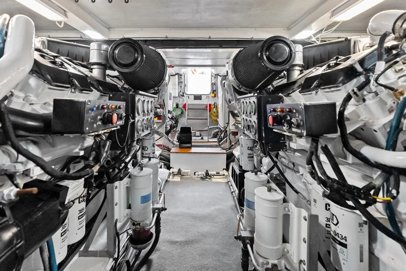 The image showcases the yacht's well-maintained engine room with powerful engines and clean surroundings. aboard EL LEGADO Yacht for Sale