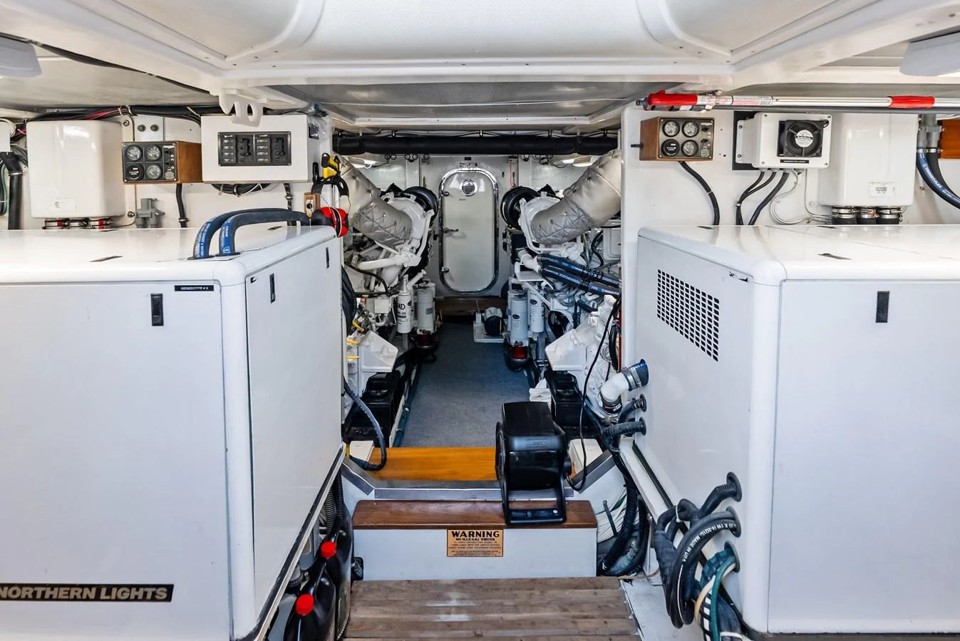 The engine room showcases well-maintained machinery and equipment, ensuring reliable performance. aboard EL LEGADO Yacht for Sale