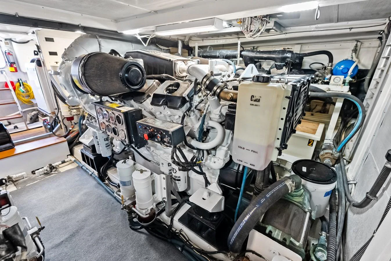 The image showcases the well-maintained engine room of the yacht, highlighting its powerful machinery and organized layout. aboard EL LEGADO Yacht for Sale