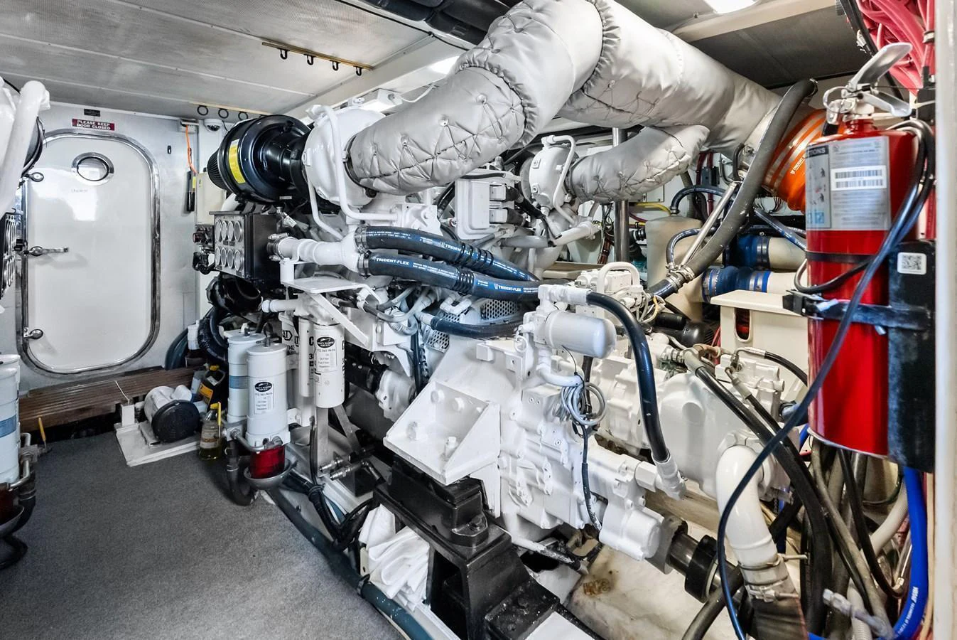 The image showcases the yacht's well-maintained engine room with advanced machinery and equipment. aboard EL LEGADO Yacht for Sale